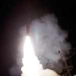 A Saturday, March 19, 2011 photo provided by the U.S. Navy shows the Arleigh Burke-class guided-missile destroyer USS Barry (DDG 52) as it launches a Tomahawk missile in support of Operation Odyssey Dawn from the Mediterranean Sea
